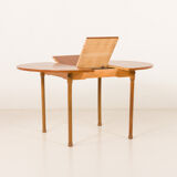 Teak round table with hidden extension, 1970s