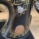 Old Singer sewing machine on pedestal