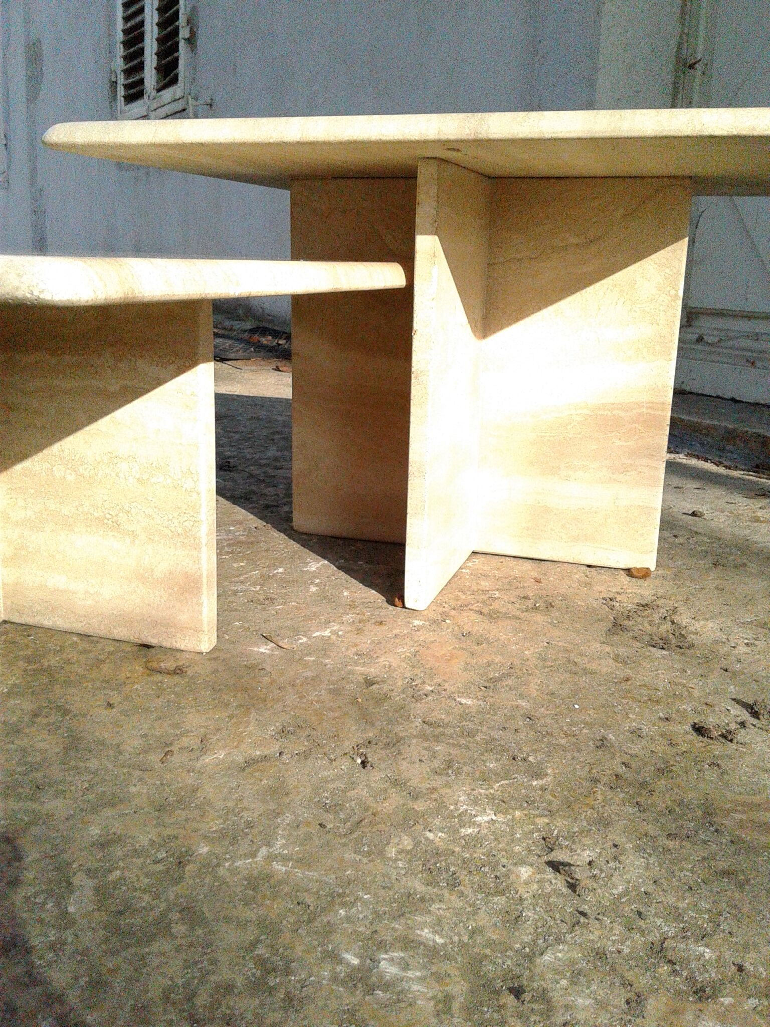 Two coffee tables giggle in travertine