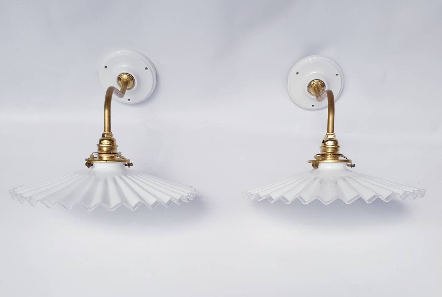 vintage wall lights in brass and pleated opal glass