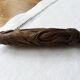 Old bread knife with a carved wooden handle
