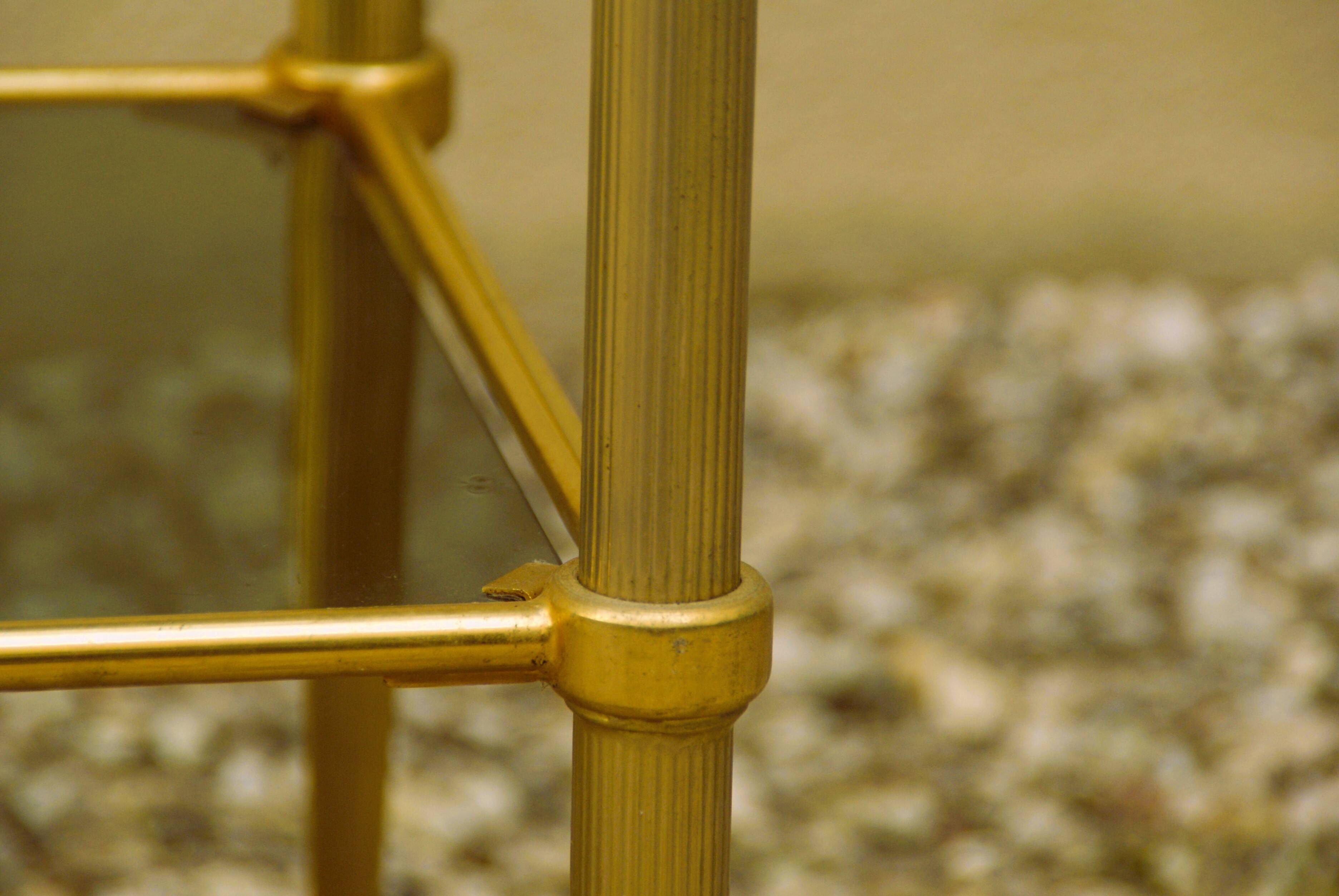 Antique brass serving trolley with smoked glass top, Louis XVI style.
