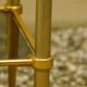 Antique brass serving trolley with smoked glass top, Louis XVI style.