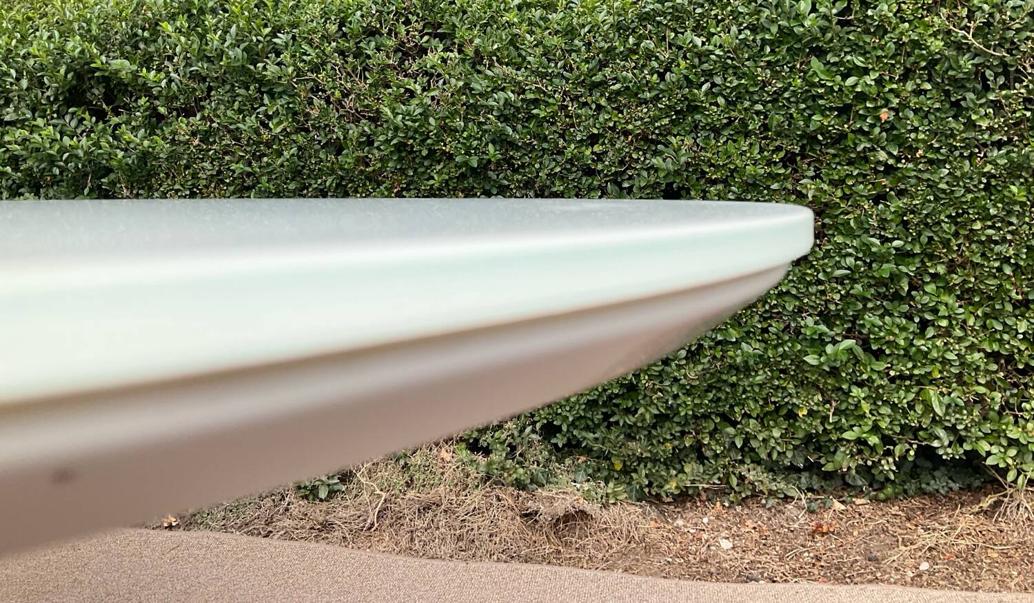 Oval designer dining table in frosted glass and brushed stainless steel