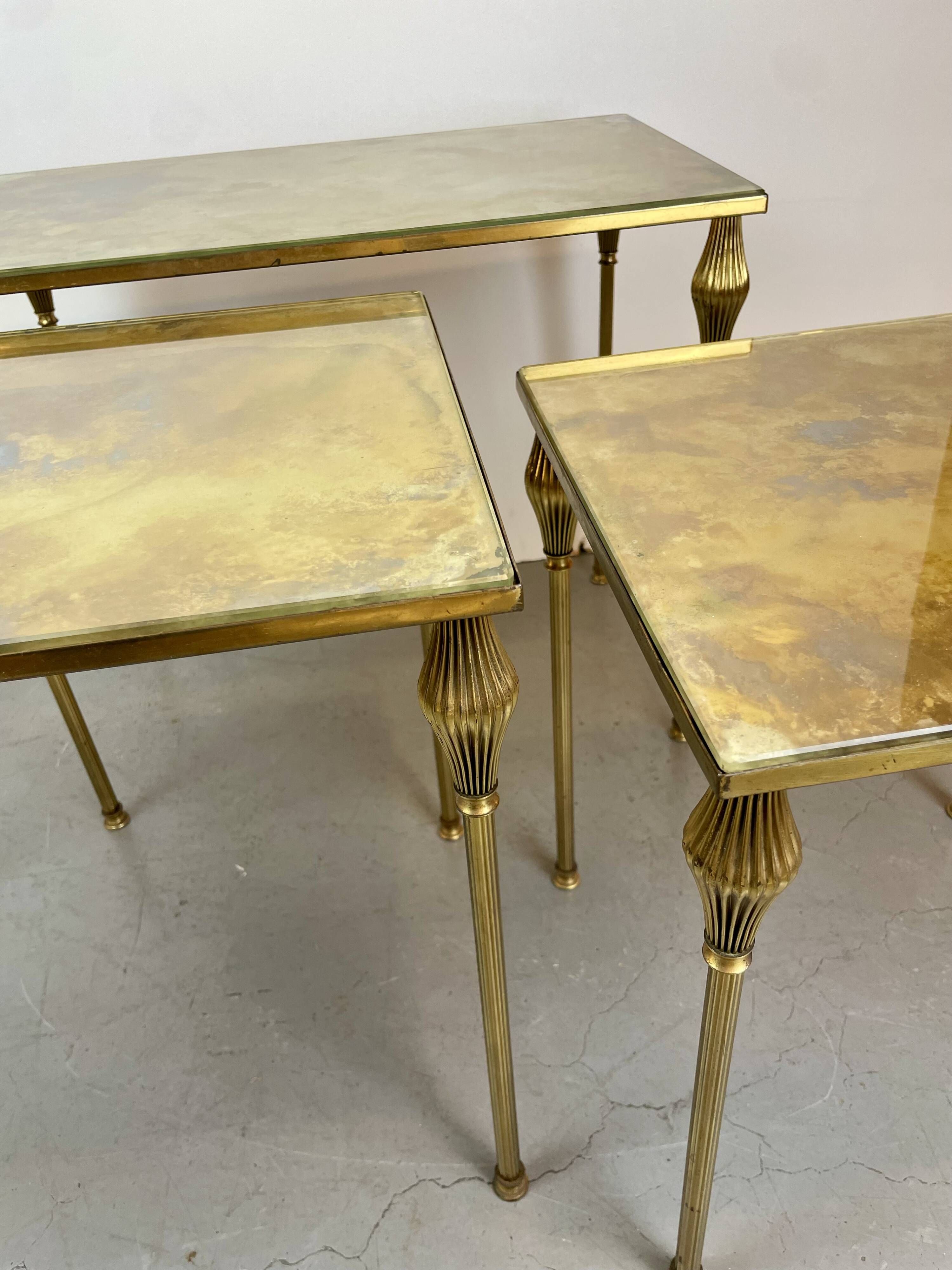 Nested brass tables, attributed to Maison Baguès, France, 1950–60.
