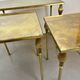 Nested brass tables, attributed to Maison Baguès, France, 1950–60.