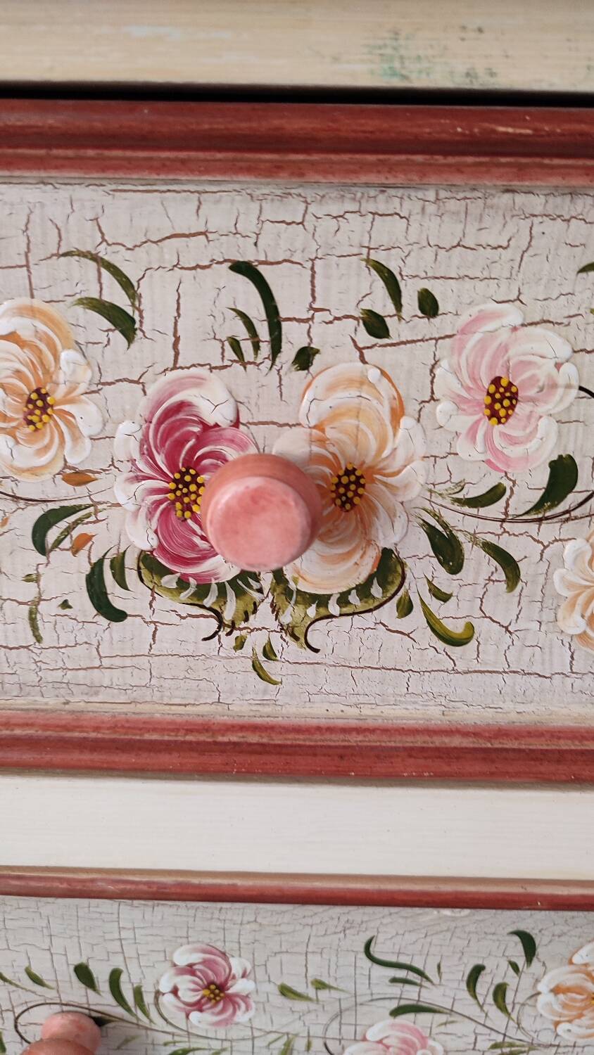 Painted chest of drawers with floral decoration