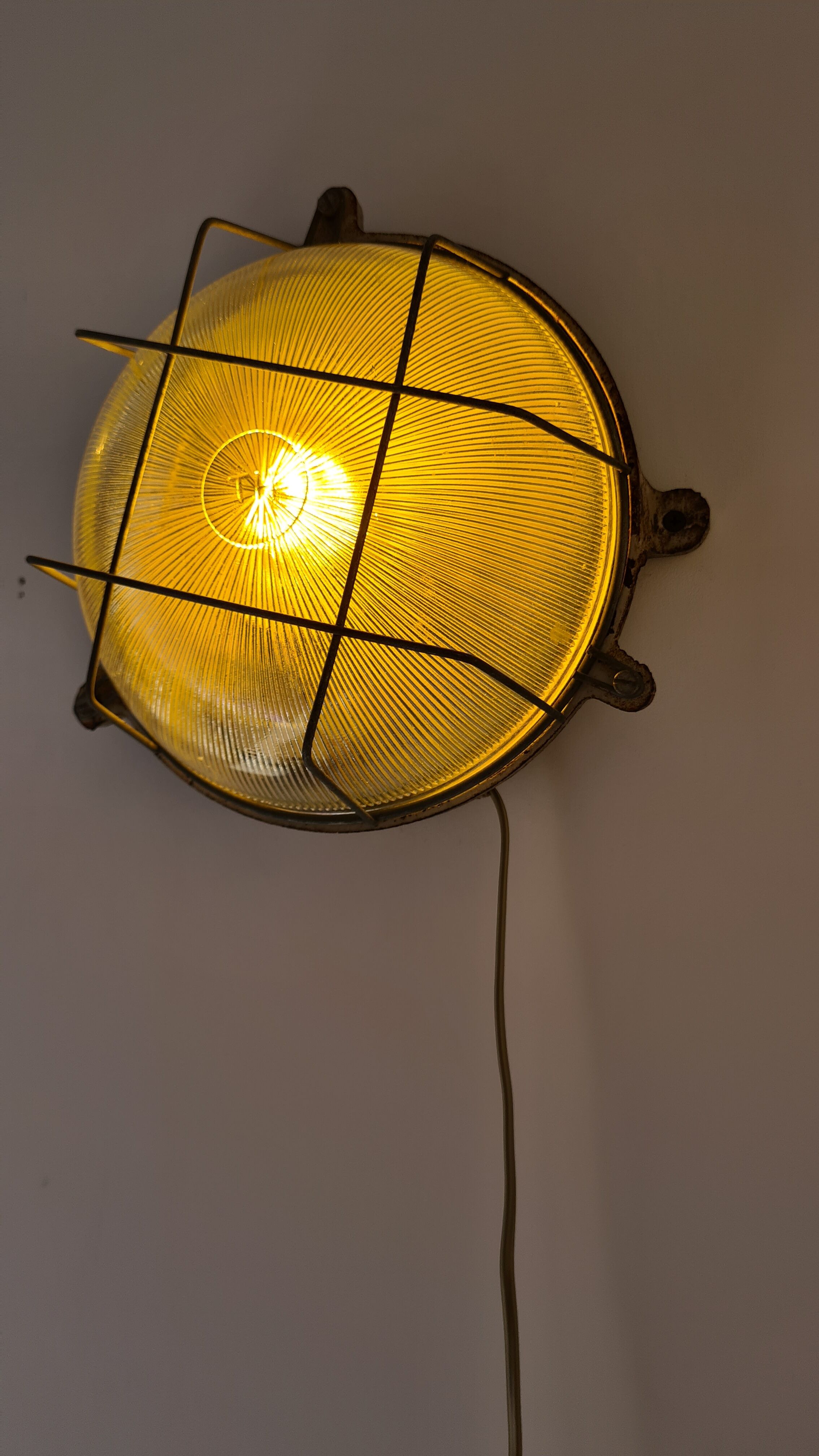 Cast iron porthole wall lamp by TH