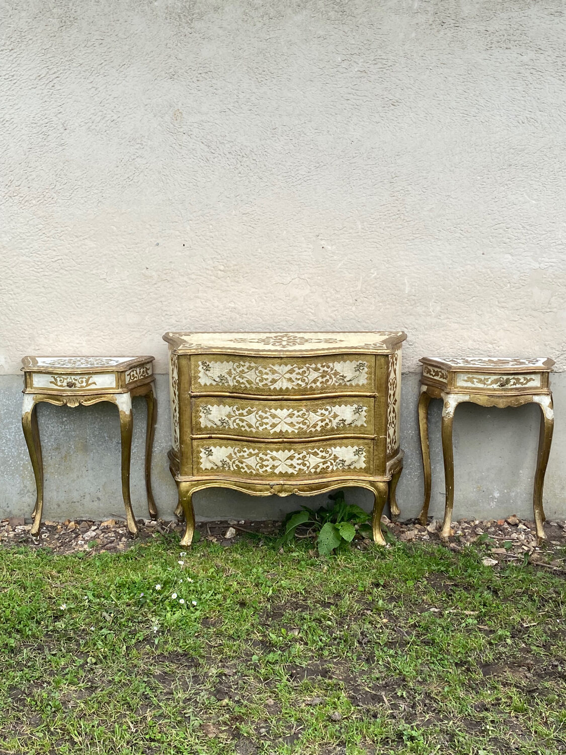 Pairs of Florentine bedside tables in gilded wood.