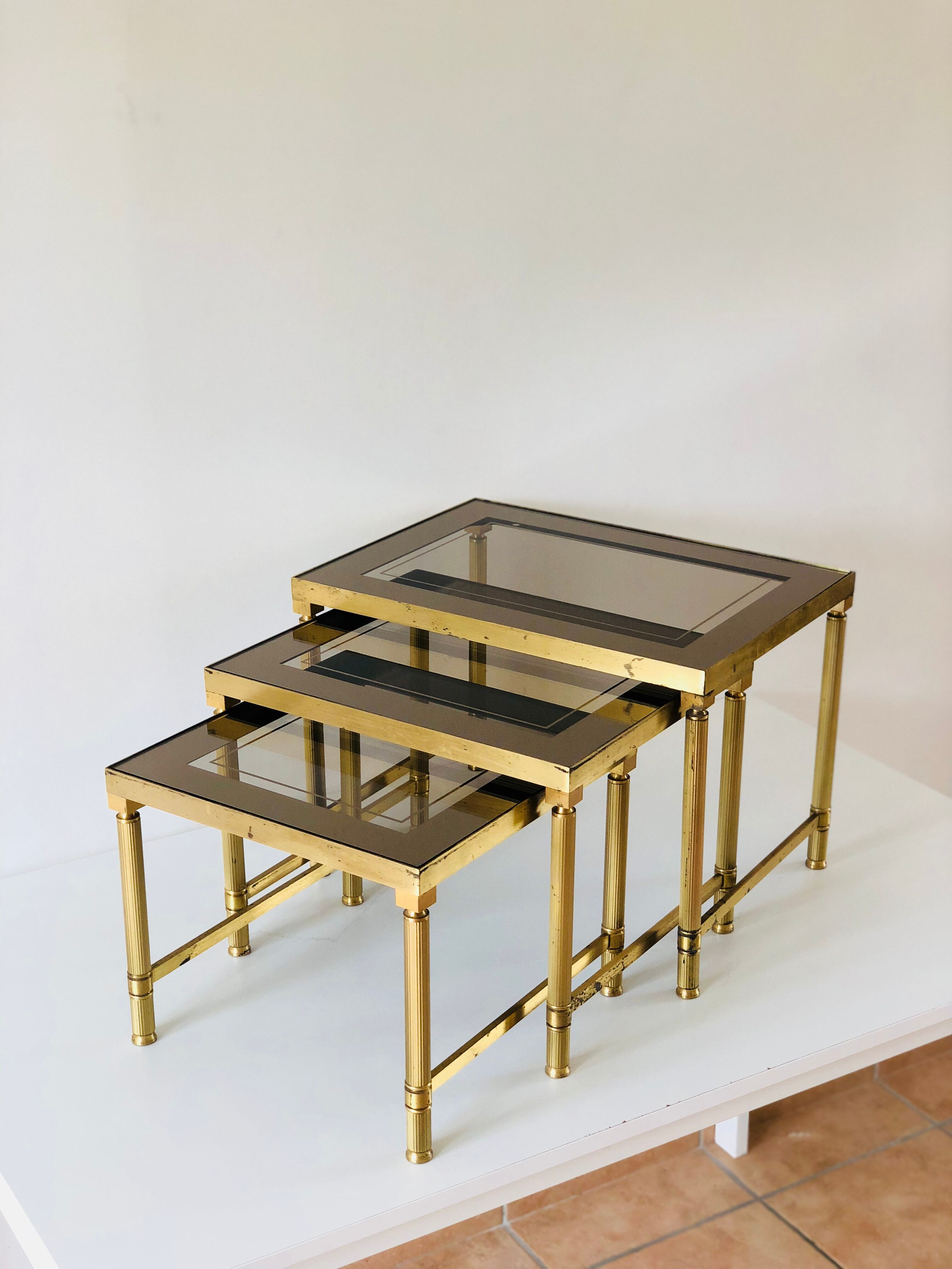 Brass and smoked glass trundle table