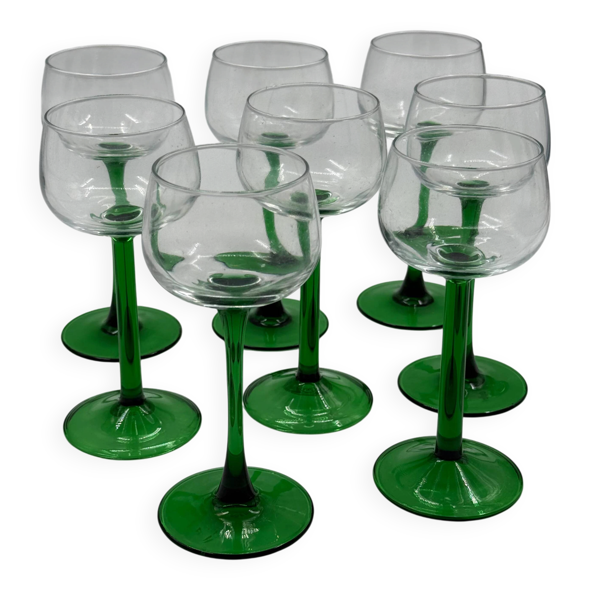 Set of 8 green stemmed wine glasses made in France.
