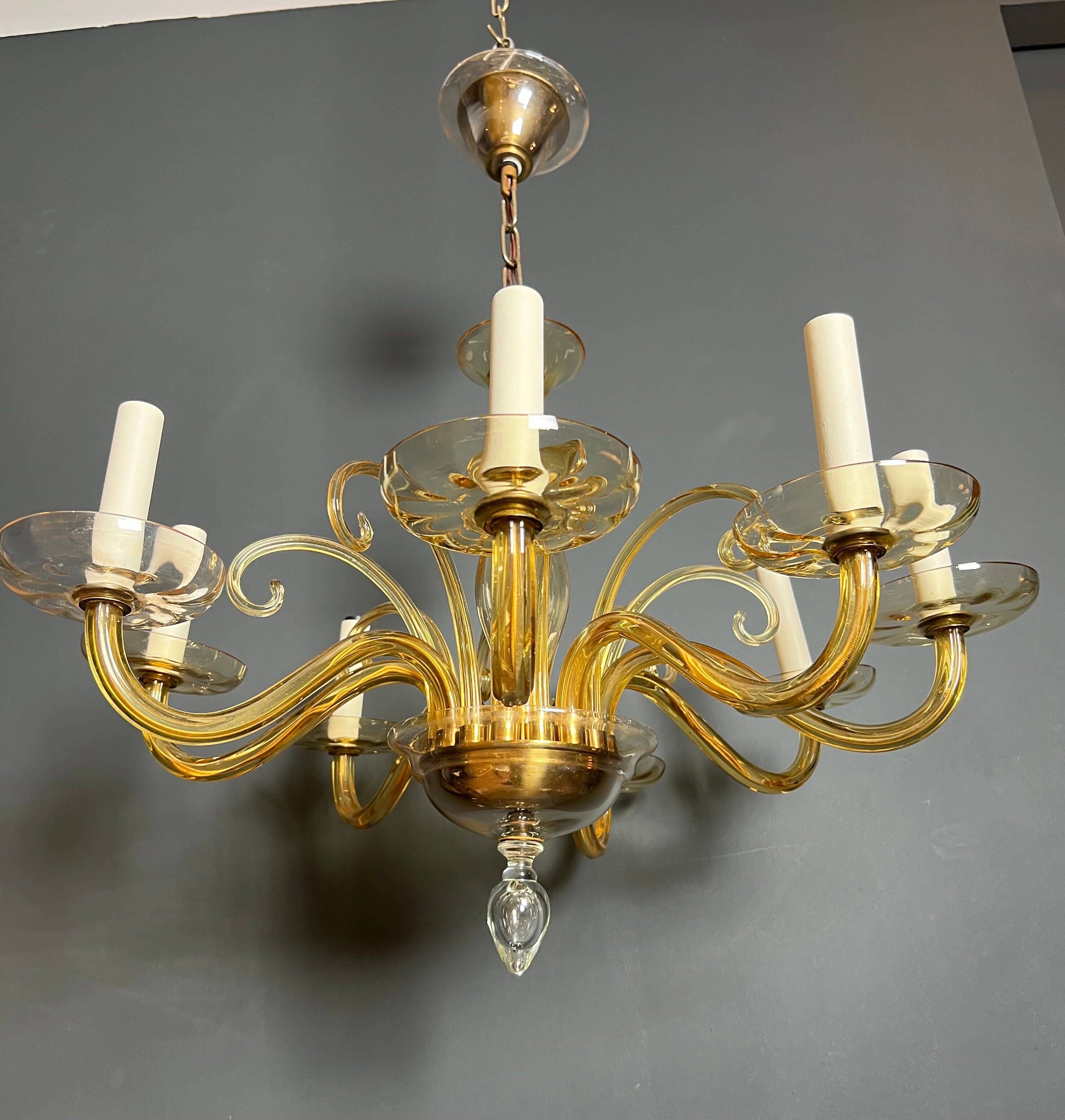 Orange Murano crystal chandelier with 8 light arms. Italian work. Circa 1970.