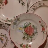 Set of four retro fruit and flower flat plates from Moustiers...