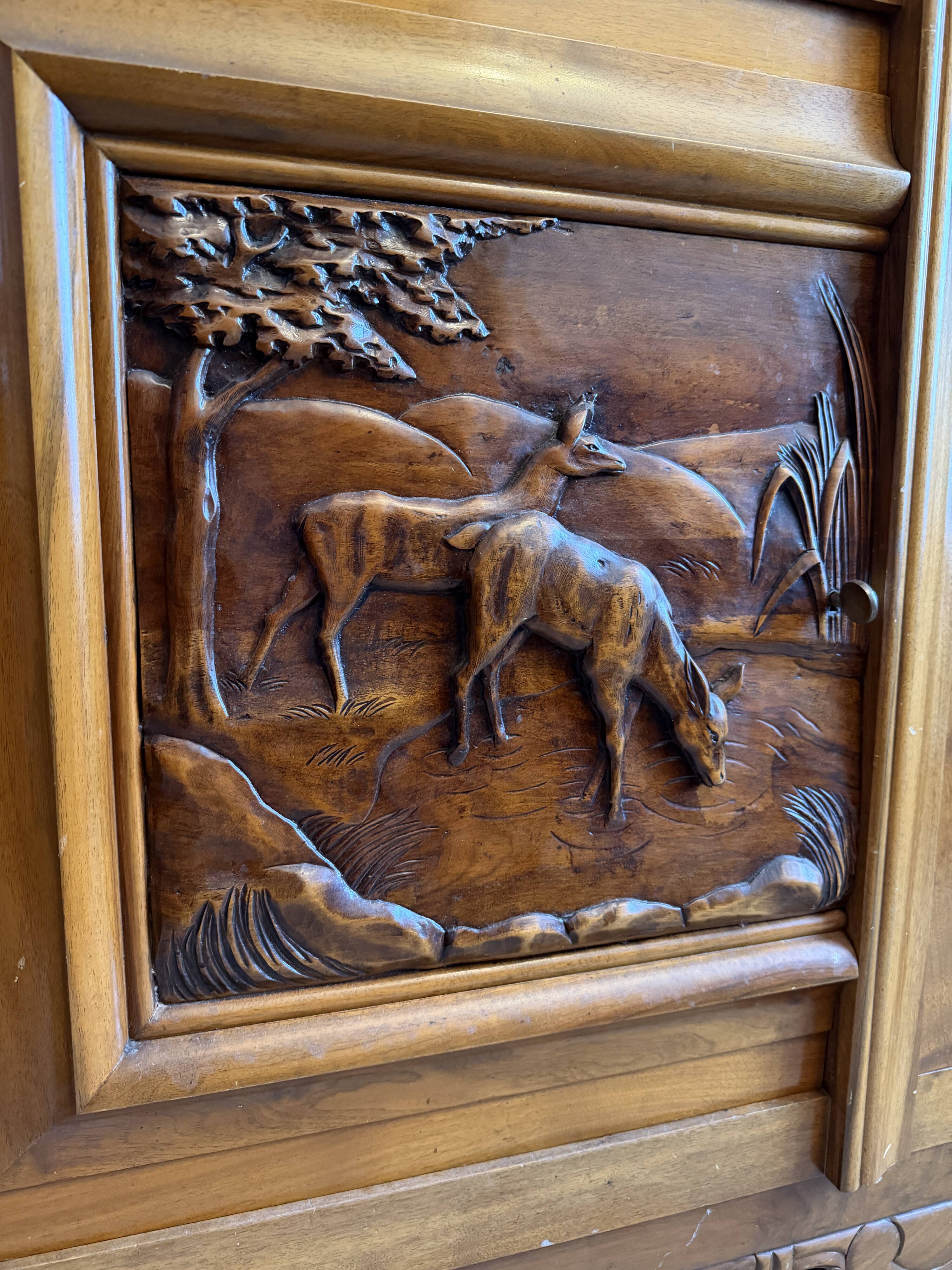 Solid wood sideboard with marble top and carved panels.