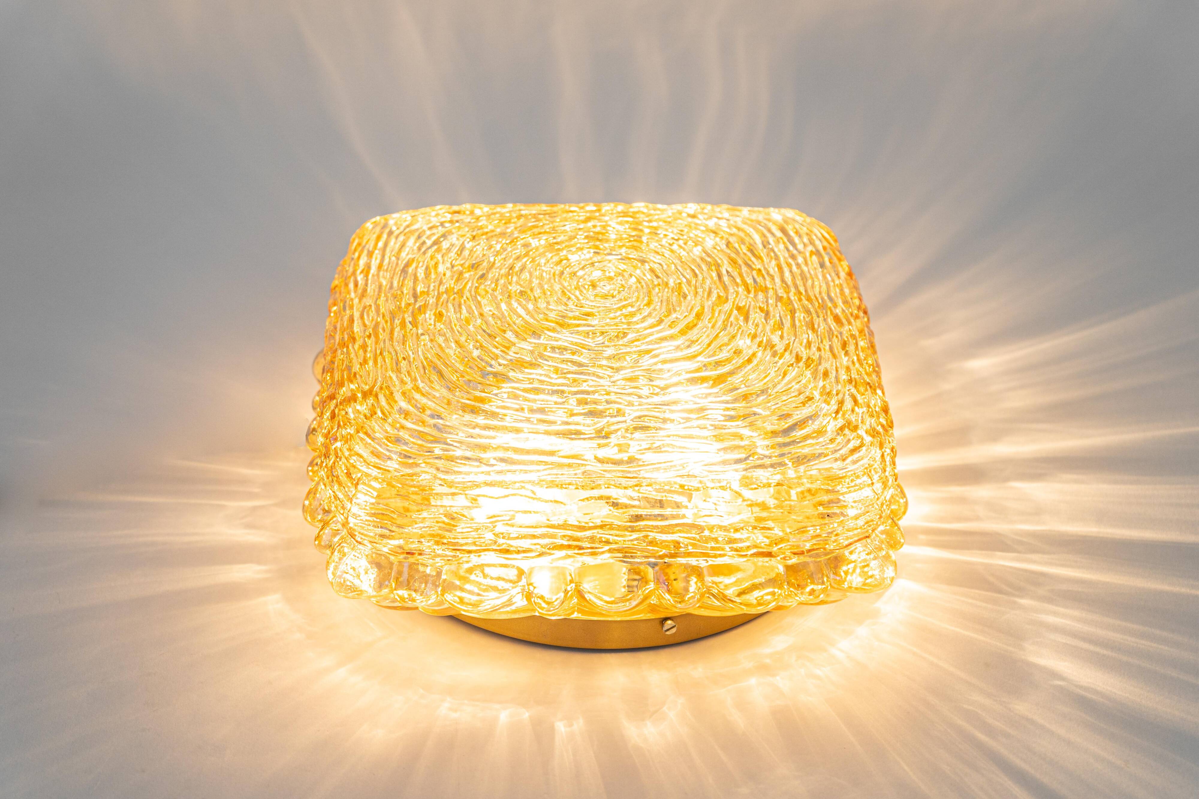 Amber glass wall light in the shape of a fingerprint, Germany, 1970s.