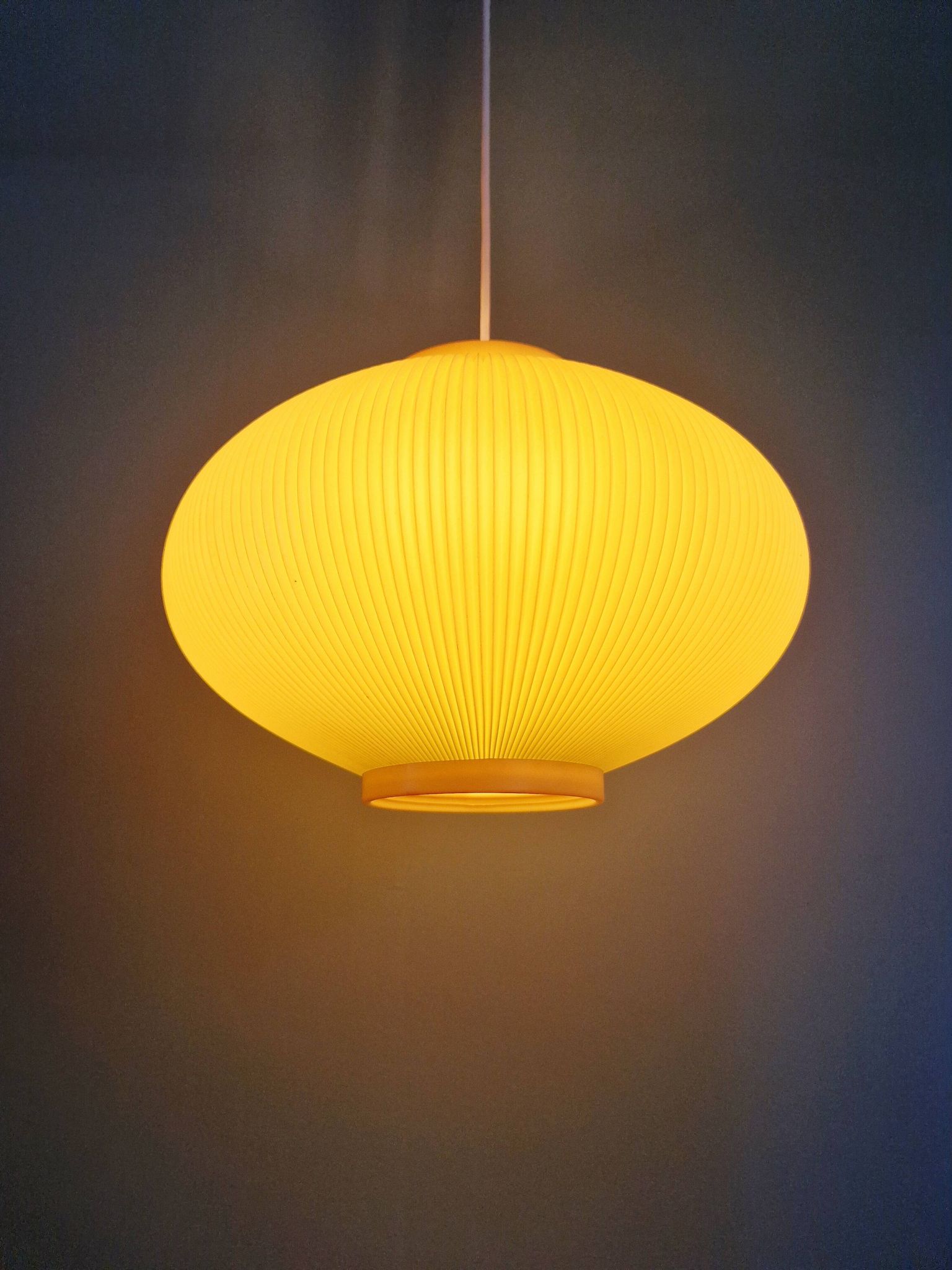 Vintage oval-shaped suspension in pleated celluloid, light green colour, 1960.