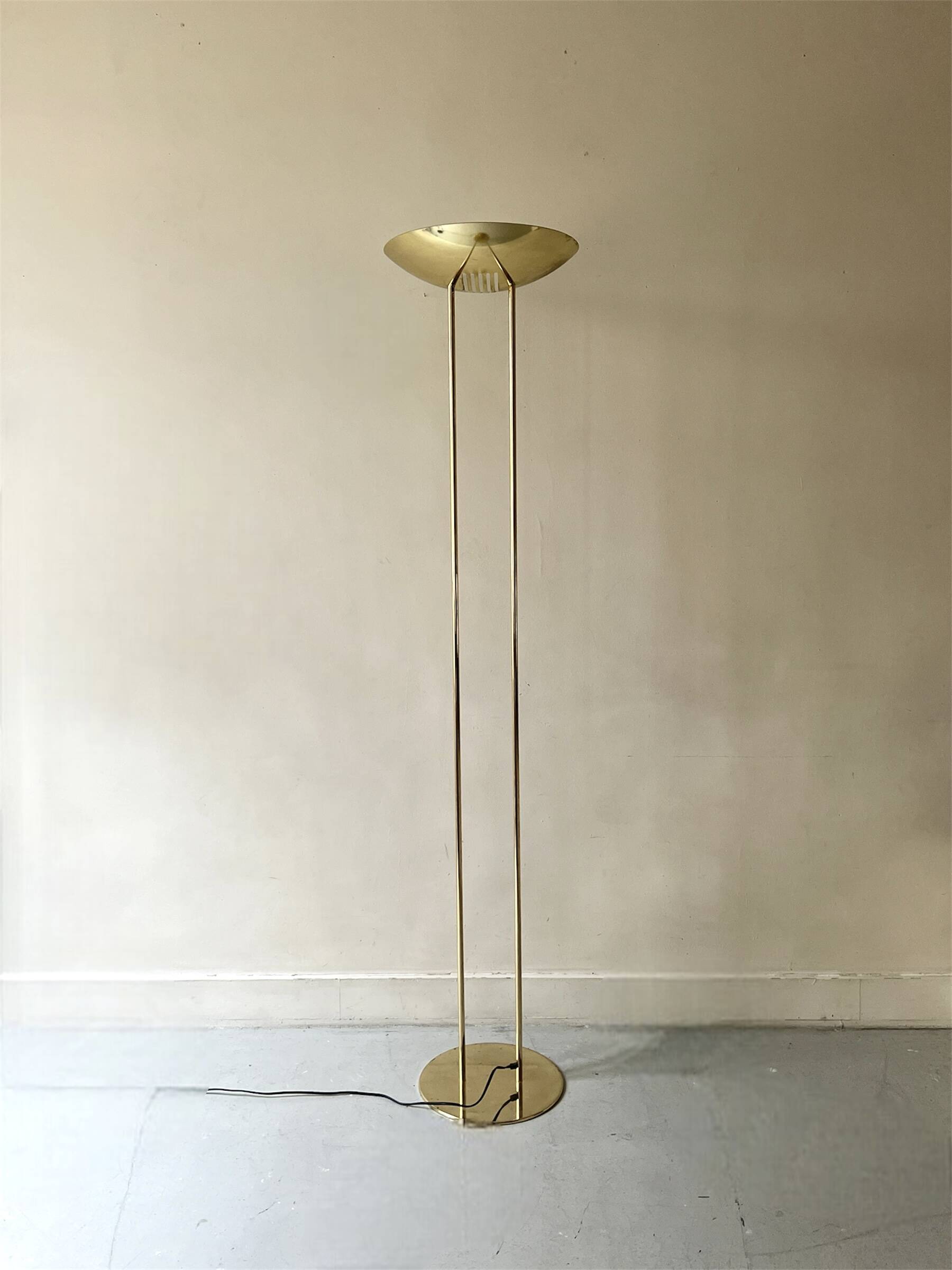 Modernist halogen floor lamp with a gold bowl, 1980.