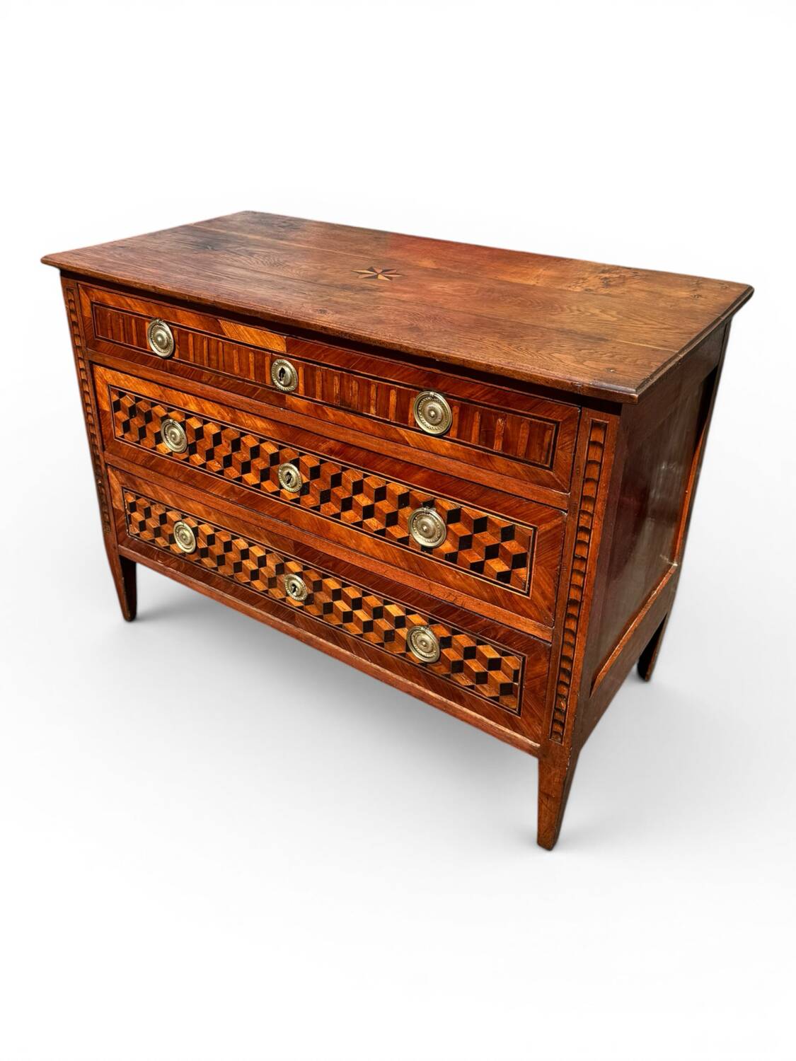 Louis XVI commode with marquetry featuring a design of precious wood cubes, 18th century.