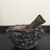 Old mortar and its ceramic pestle Fat Lava