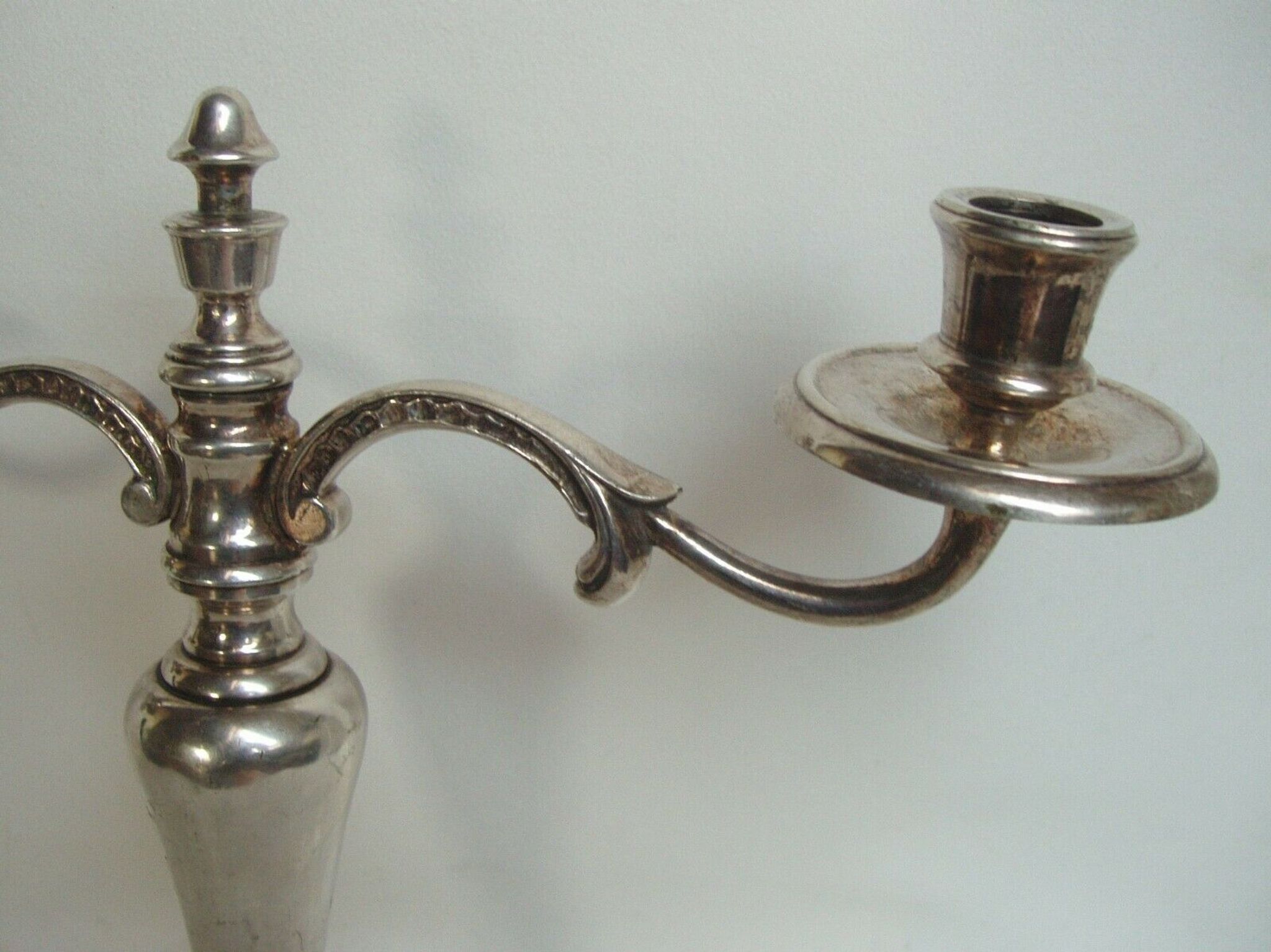 Two-branch silver-plated candle holder from the early twentieth century.