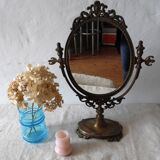 Psyche on foot brass mirror 28x39cm