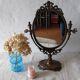 Psyche on foot brass mirror 28x39cm