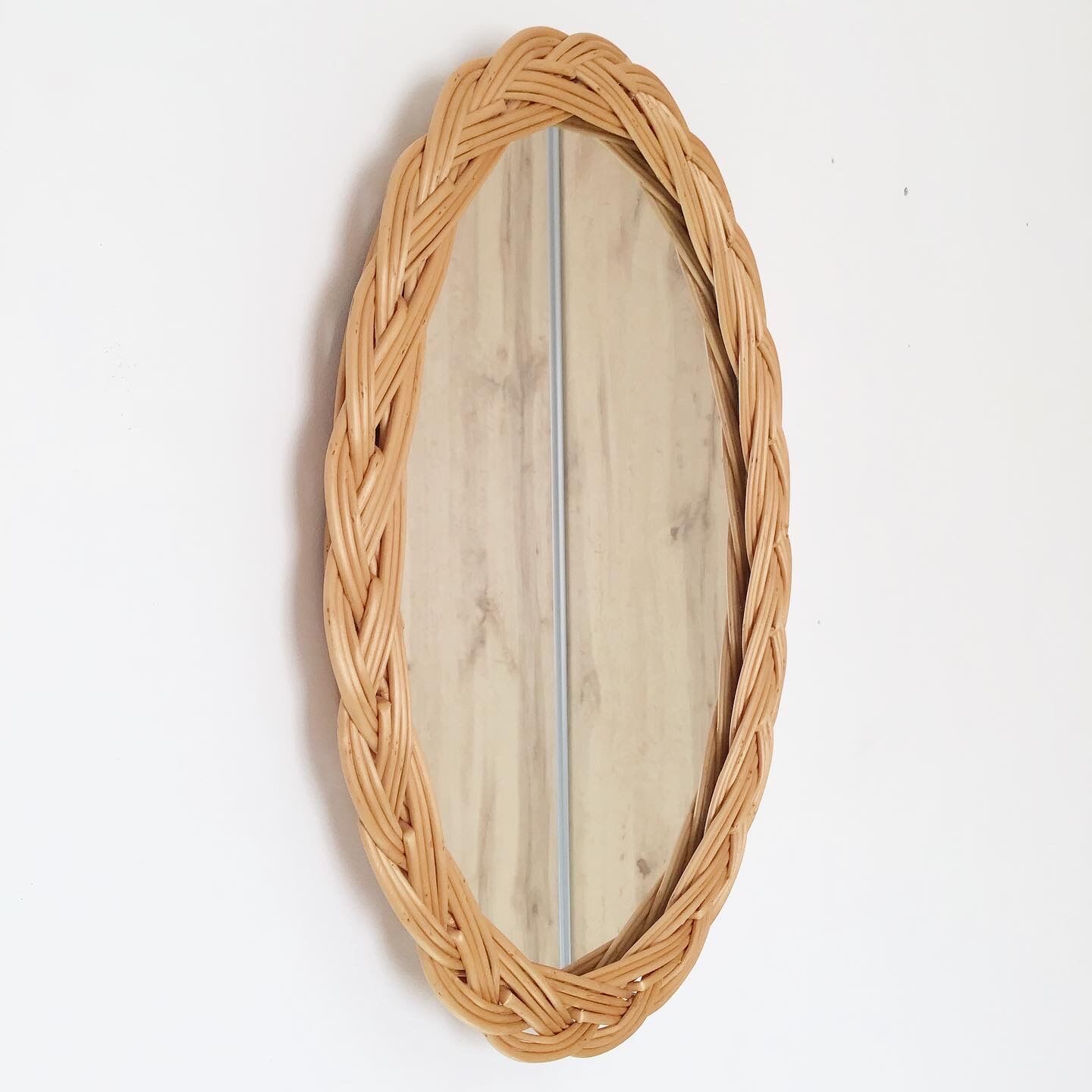 Vintage oval rattan mirror