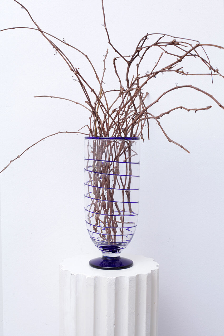 Transparent Murano glass vase and blue net