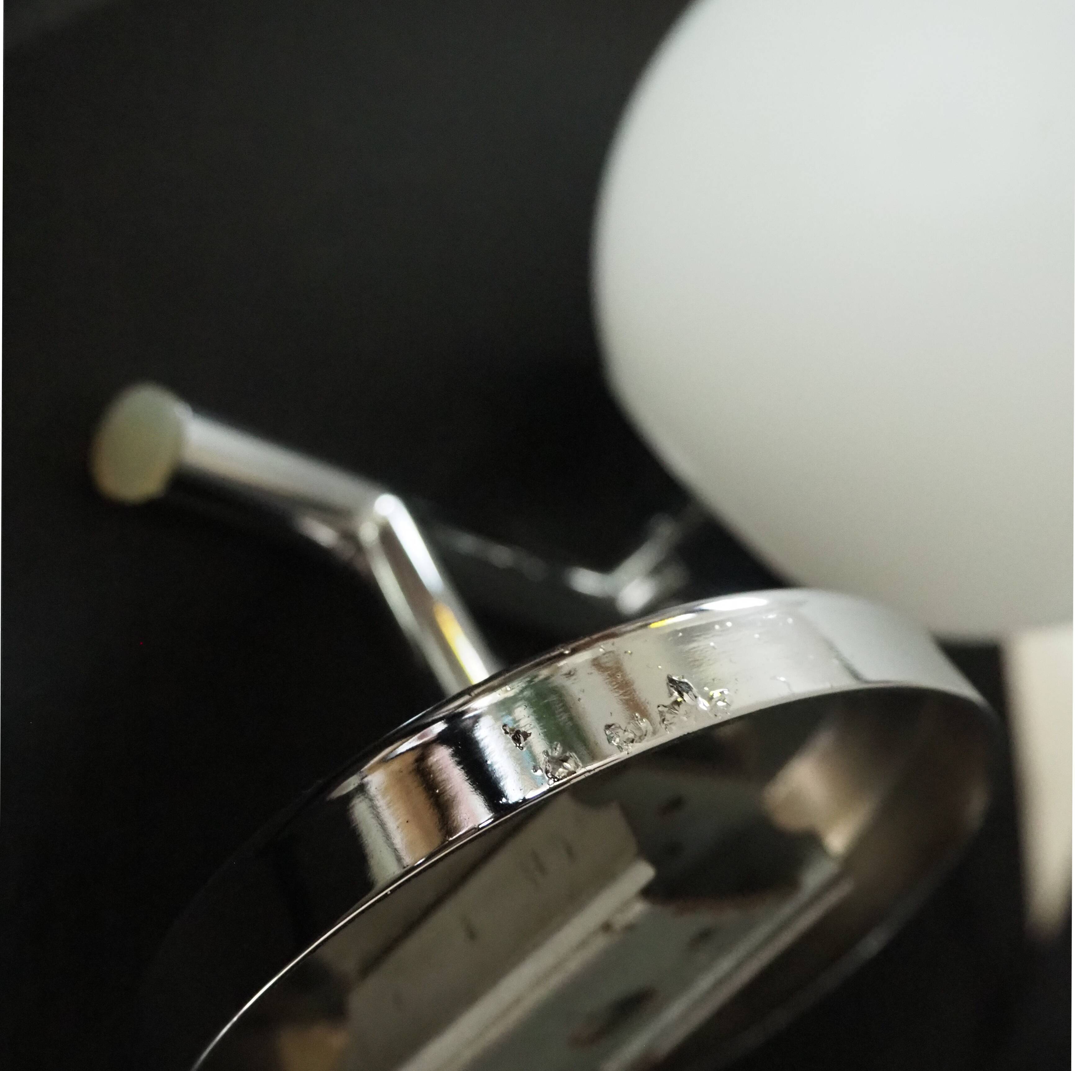 Pair of sconces with an opaline globe and chrome structure from the 1970s