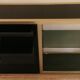 Console set and its mirror, black and gold, 80s