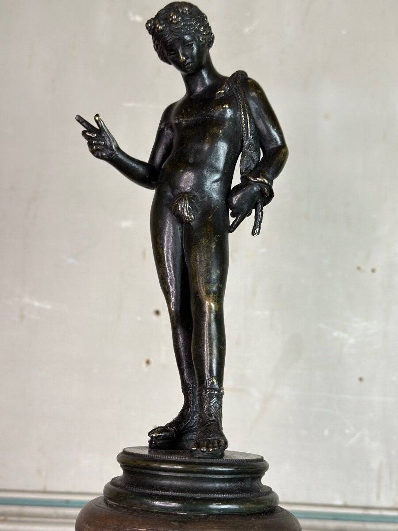 Narcissus, bronze after the antique on a wooden base, circa 1880.