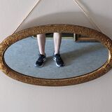 Art Deco oval mirror in gilded wood, France circa 1920