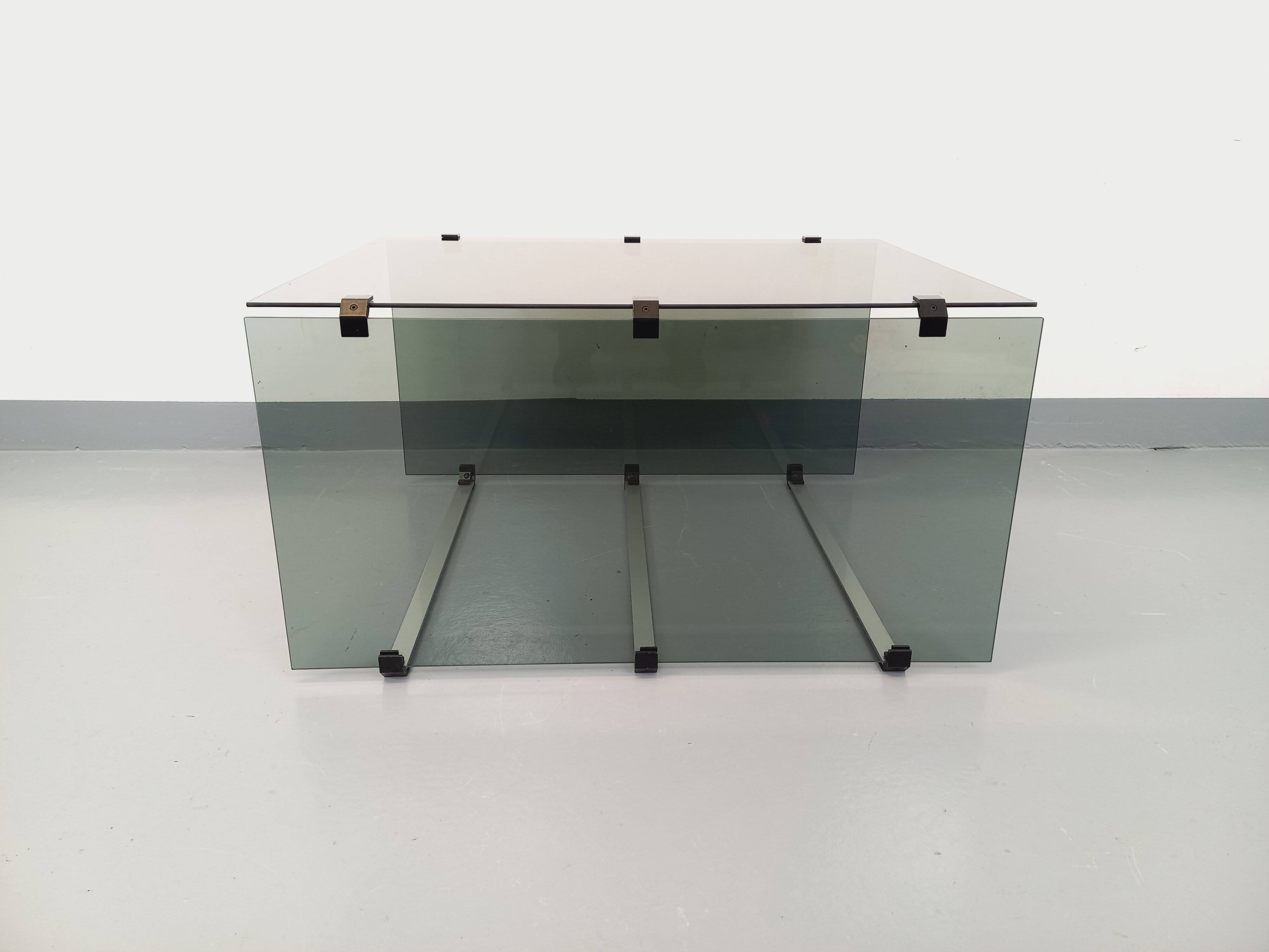 Vintage coffee table in smoked glass, black metal and cast aluminum