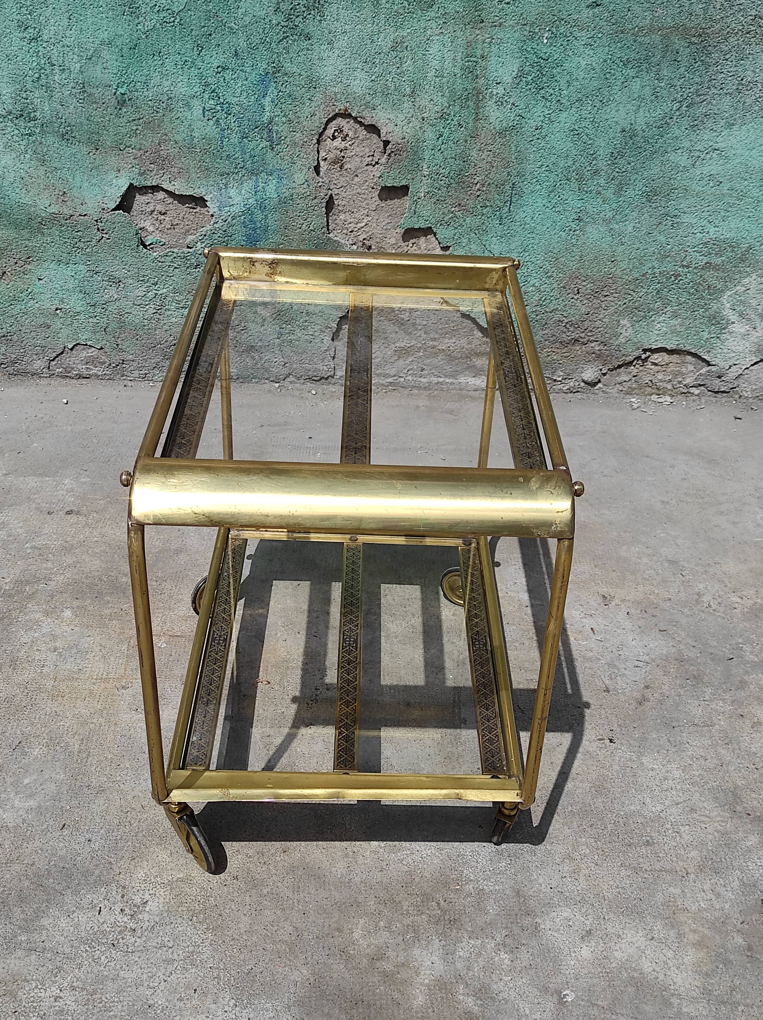 Old rolling coffee table serving vintage brass bar 50s mid-century design