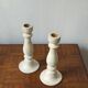 Pair of white wooden candlesticks