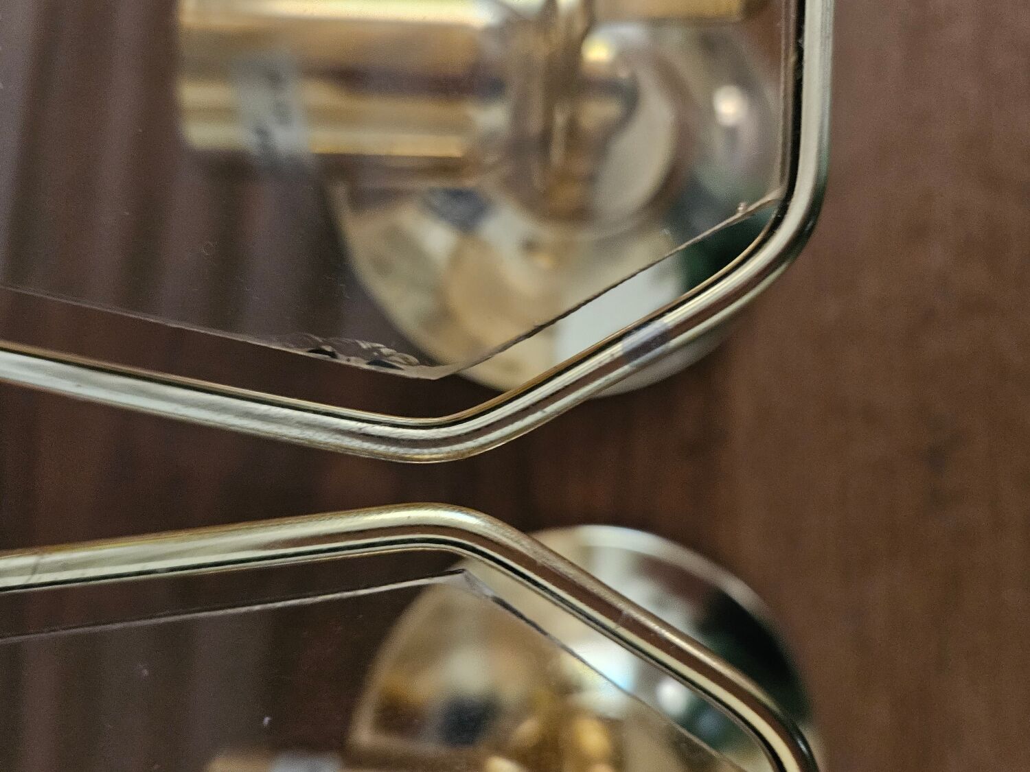 Pair of glass and metal wall lights