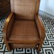 Colonial rattan armchair with ottoman