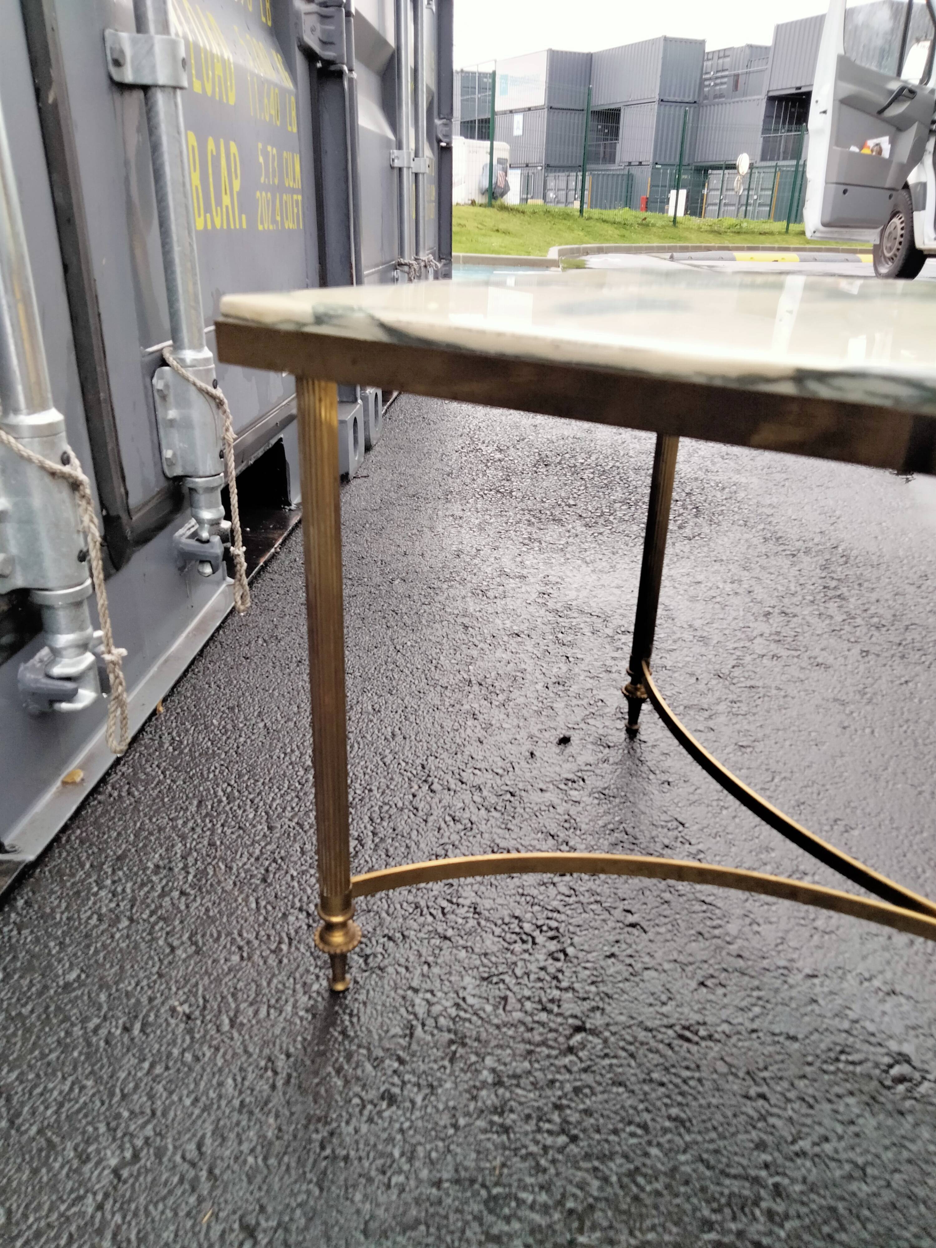 Old vintage gilded side table with marble top
