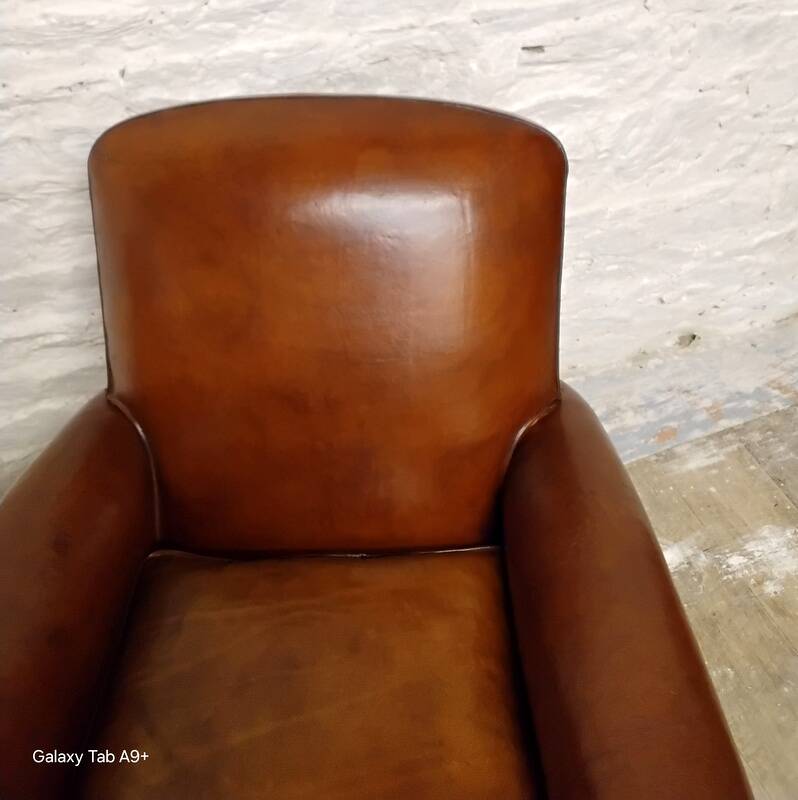 Restored horsehair club chair with curved back