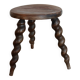 Antique tripod stool made of turned wood.