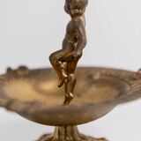 Vintage brass ashtray from the 1940s with a nude boy figurine on a footed base.