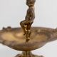 Vintage brass ashtray from the 1940s with a nude boy figurine on a footed base.