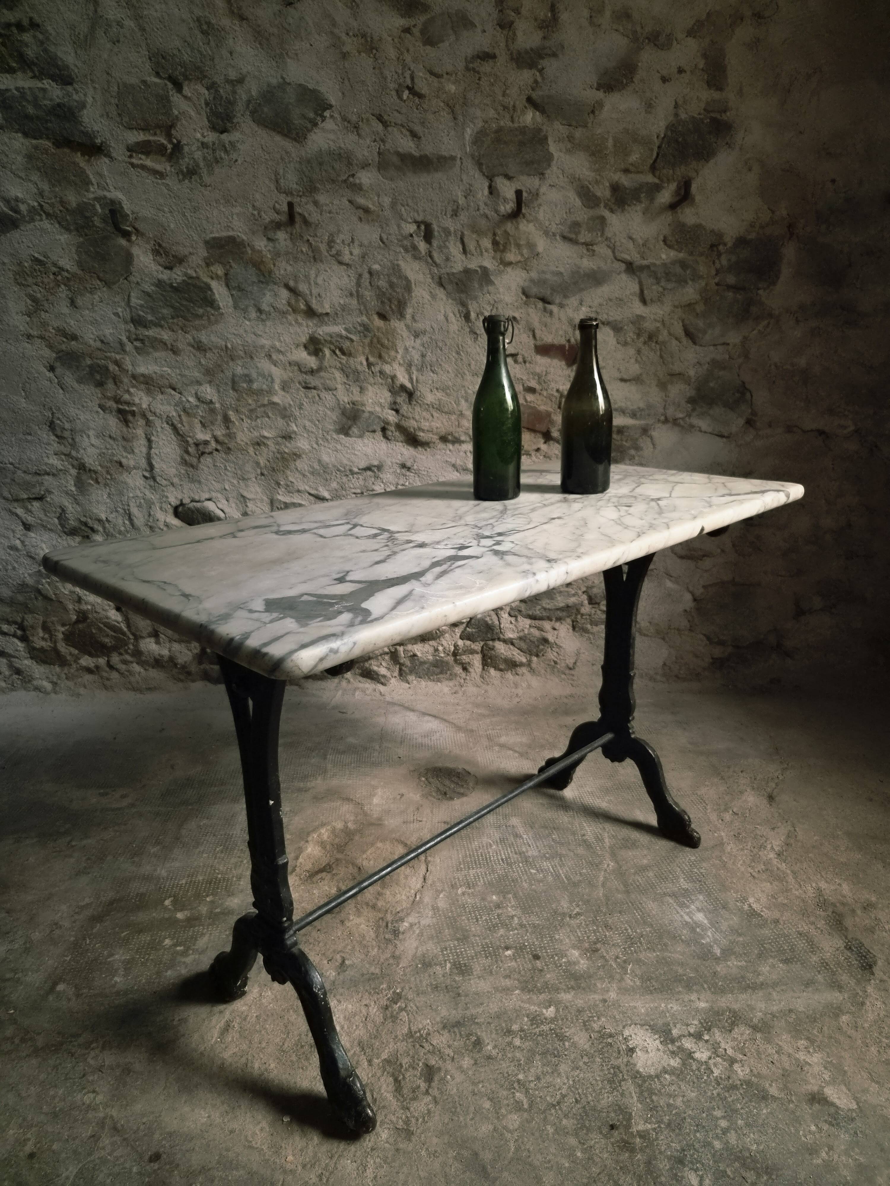 French bistro table made of marble with a cast iron base, 1920s–1930s.