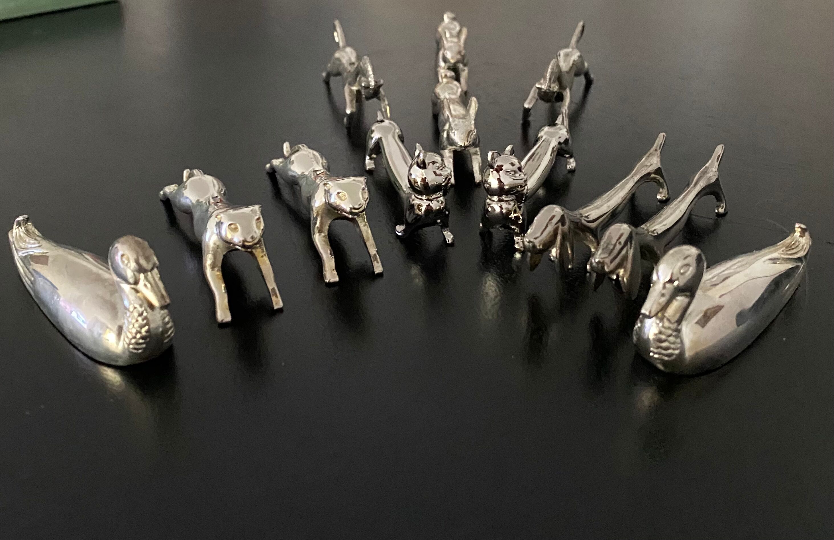 12 knife holders form various metal animals