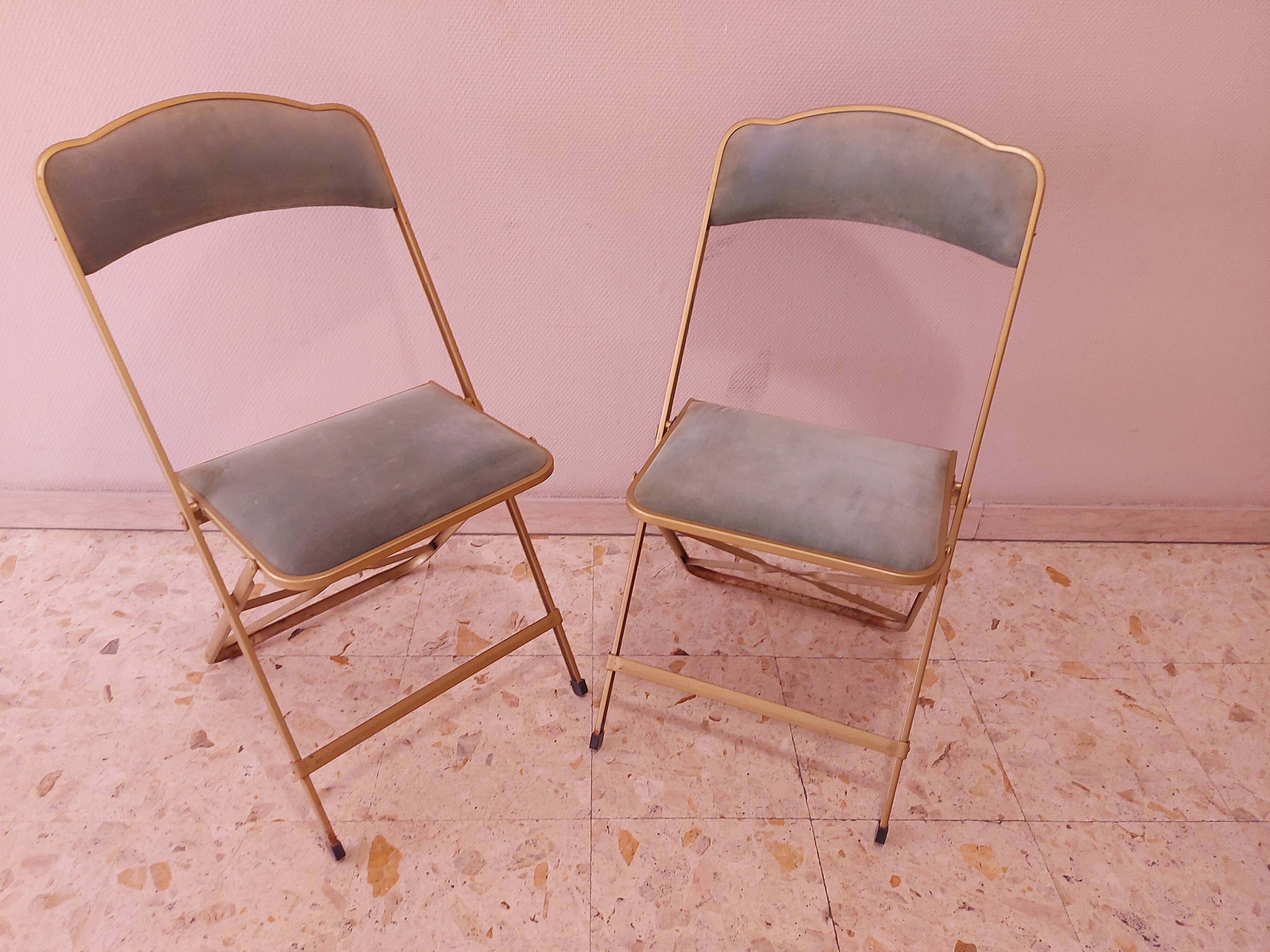Two folding opera chairs in velvet