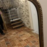 Large gilded mirror with pediment