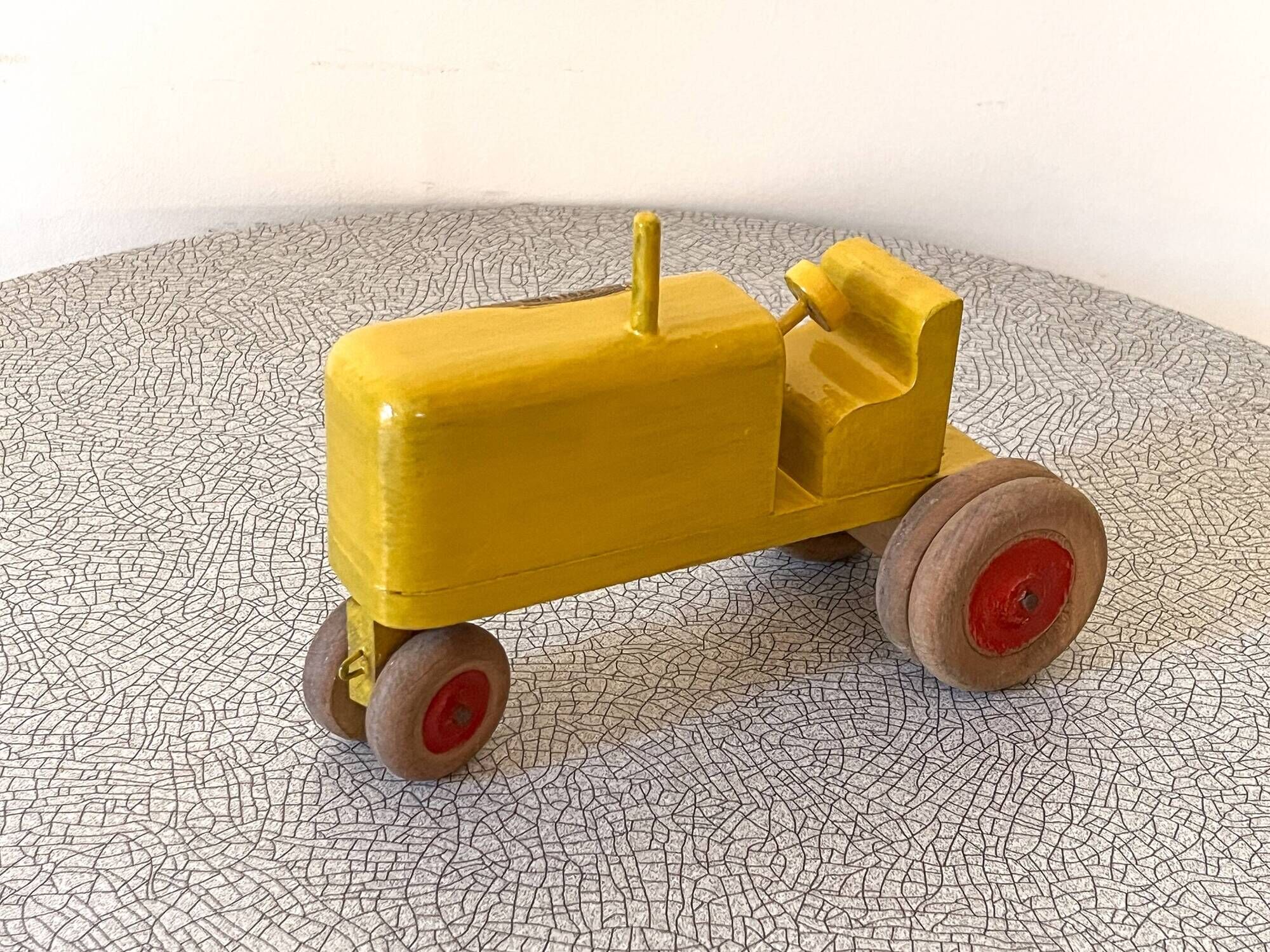 Wooden tractor from the French brand "Ateliers du Père Noël"