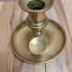 Antique brass candlestick with pusher