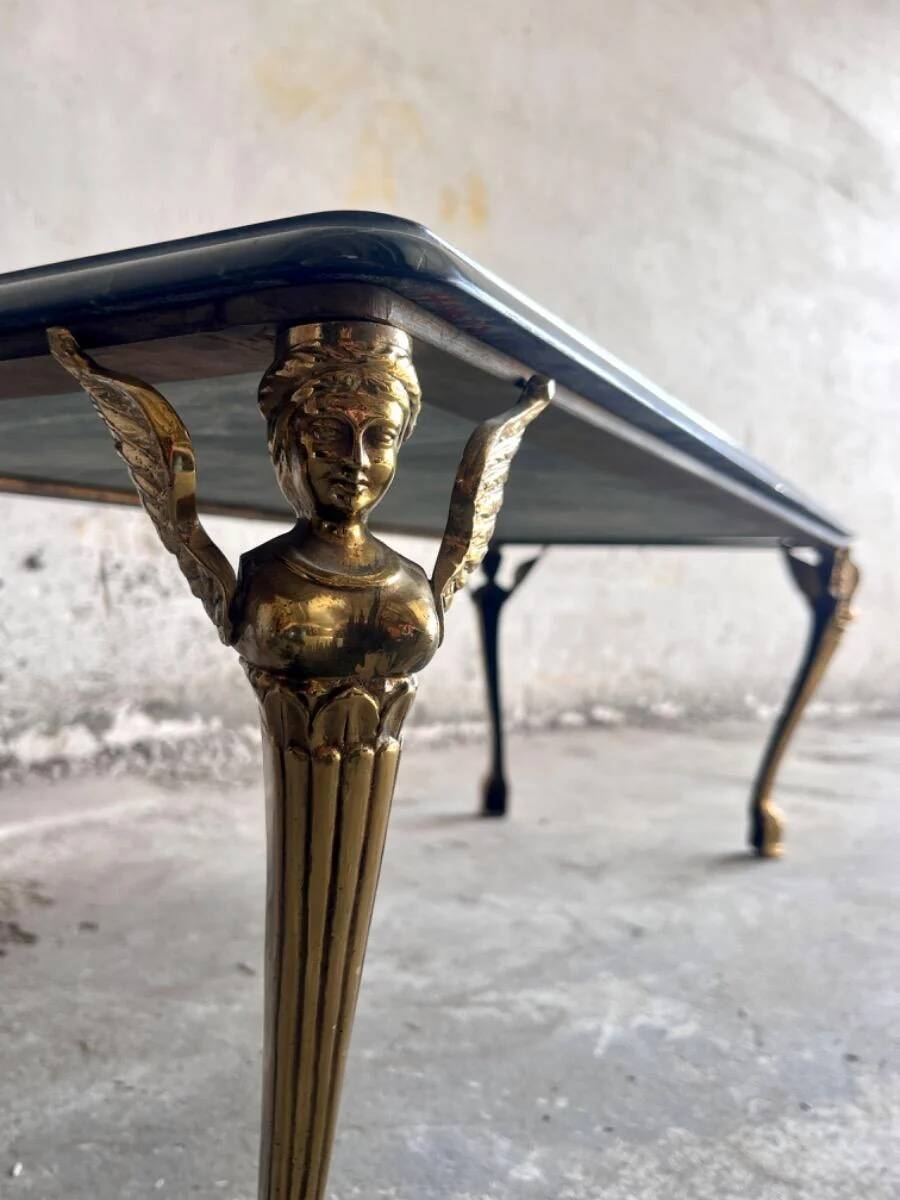 Vintage coffee table with a green marble top and gold legs.