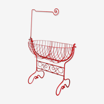 Baby cradle in red wrought iron